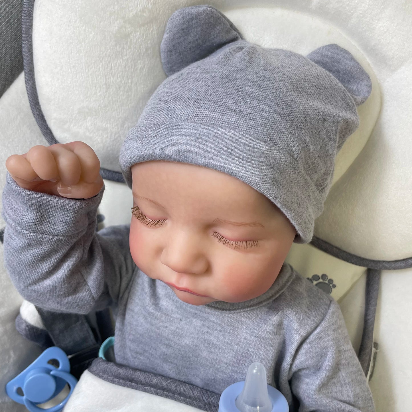 46 cm Reborn Baby Doll Levi in realistic outfit lying in crib