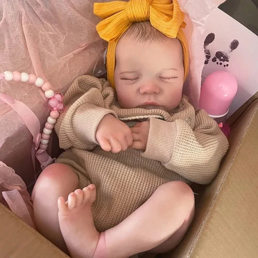 Handmade 43cm vinyl reborn baby doll in newborn outfit