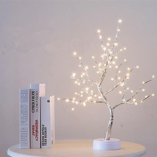 Beautifully crafted tree in the image of a delicate bonsai tree, decorated with cherry blossoms and covered in wonderful warm lights. It has malleable branches so you can model your tree the way you want!