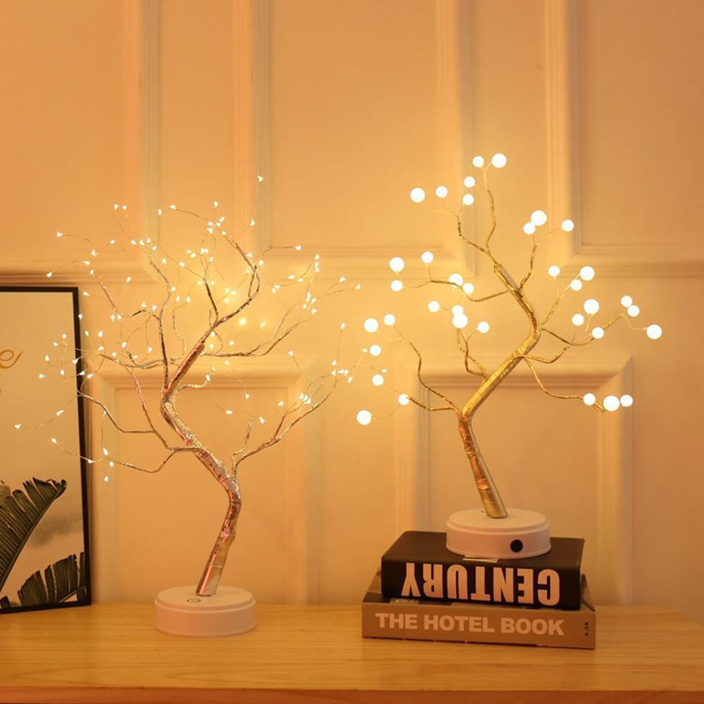 Beautifully crafted tree in the image of a delicate bonsai tree, decorated with cherry blossoms and covered in wonderful warm lights. It has malleable branches so you can model your tree the way you want!