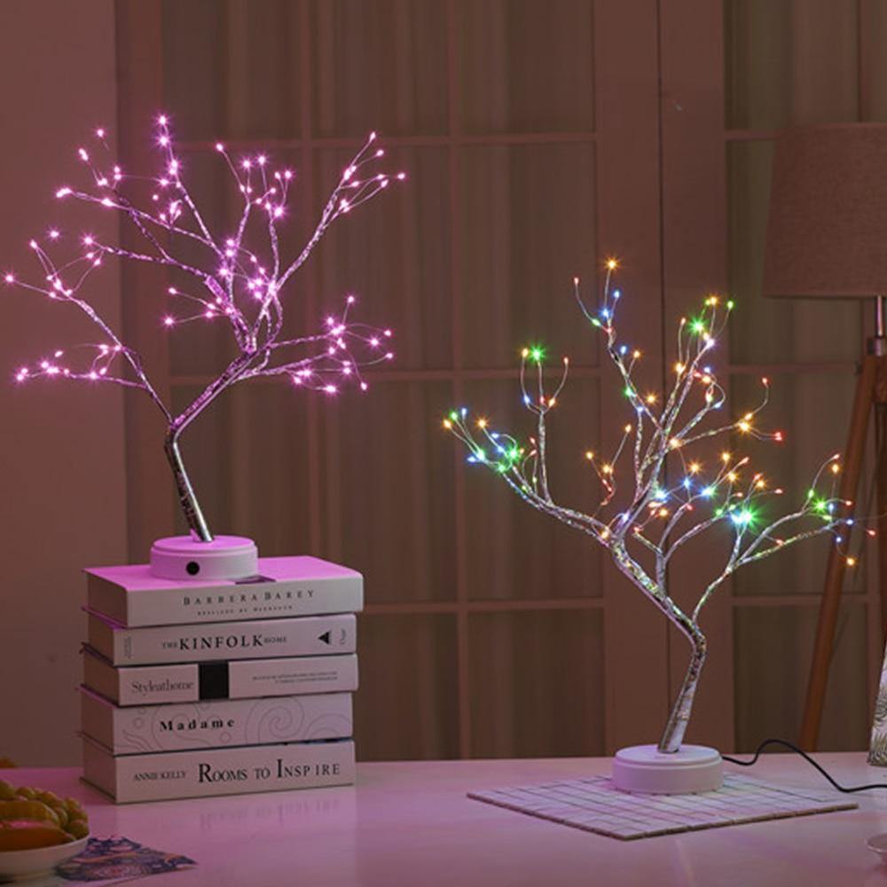 Beautifully crafted tree in the image of a delicate bonsai tree, decorated with cherry blossoms and covered in wonderful warm lights. It has malleable branches so you can model your tree the way you want!