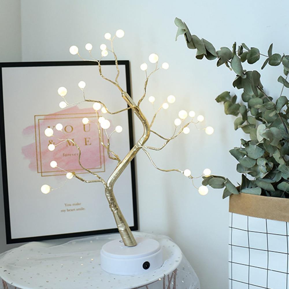 Beautifully crafted tree in the image of a delicate bonsai tree, decorated with cherry blossoms and covered in wonderful warm lights. It has malleable branches so you can model your tree the way you want!